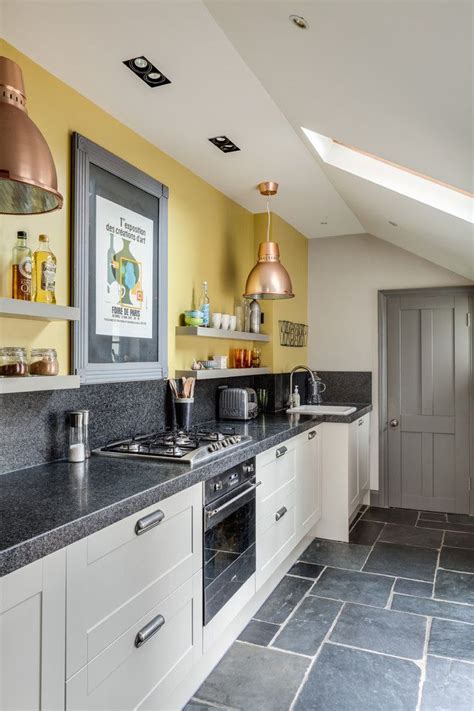 yellow walls with gray cabinets